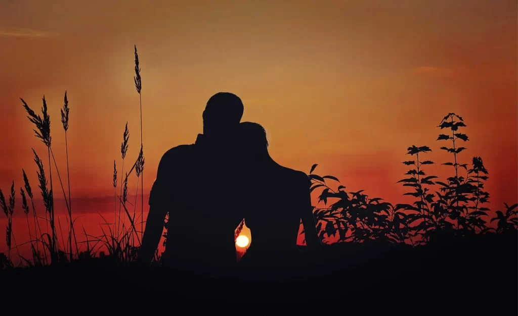 Two lovers enjoy the sunset