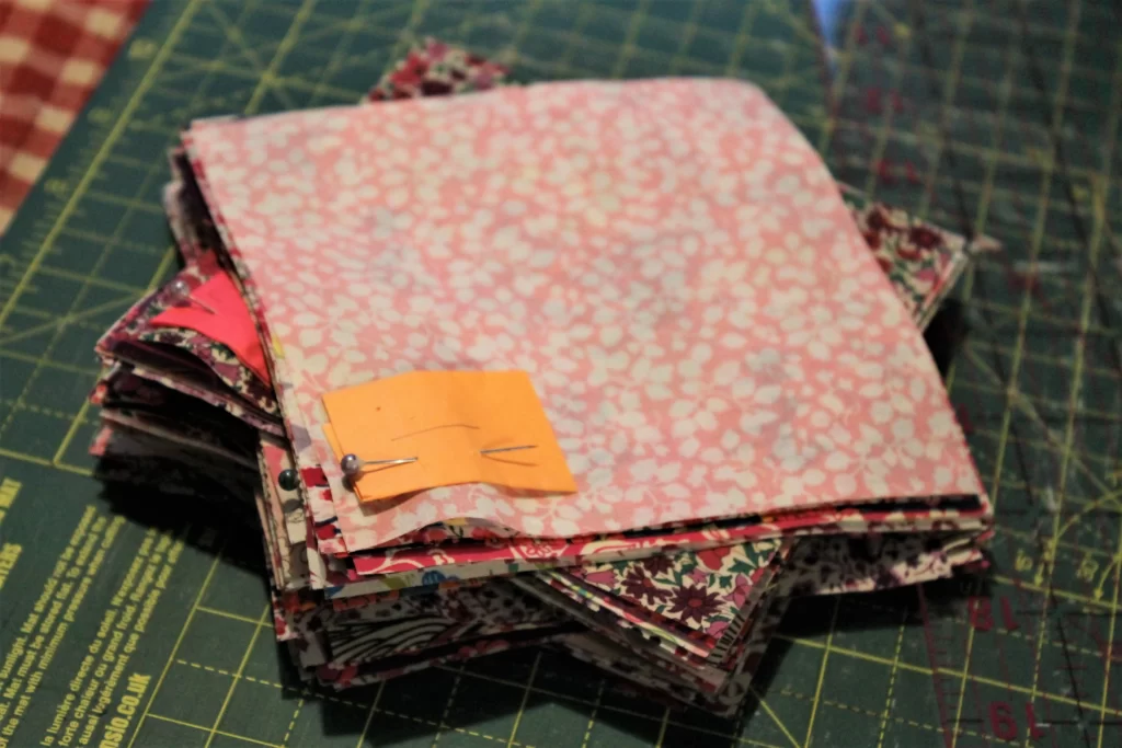 pile of pink quilt fabric