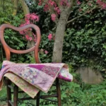 pink patchwork quilt on a chair in garden
