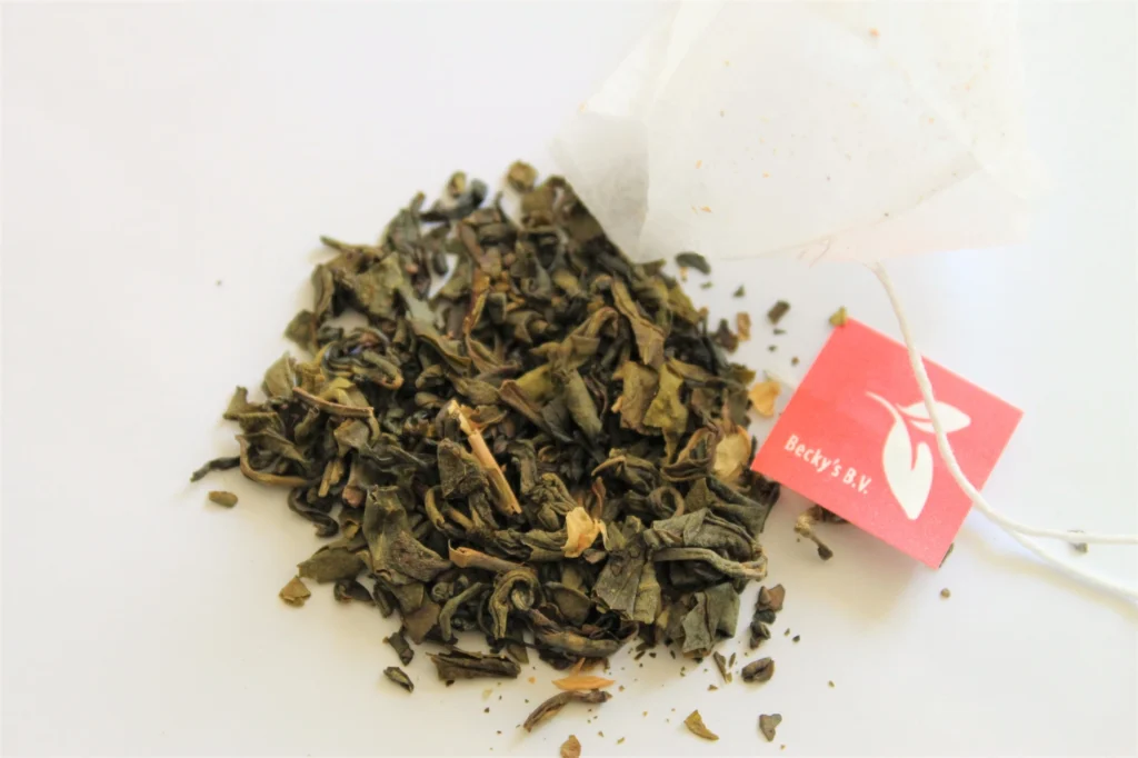 green tea leaves with jasmine petals