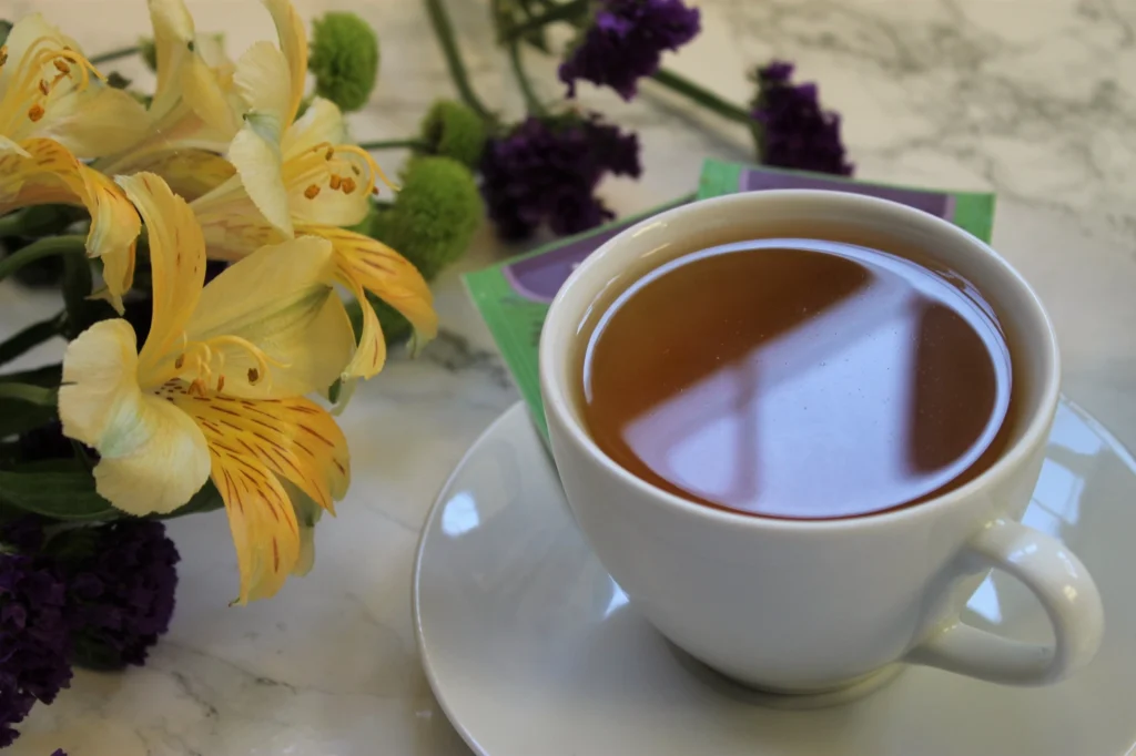 white teacup flowers green teabags