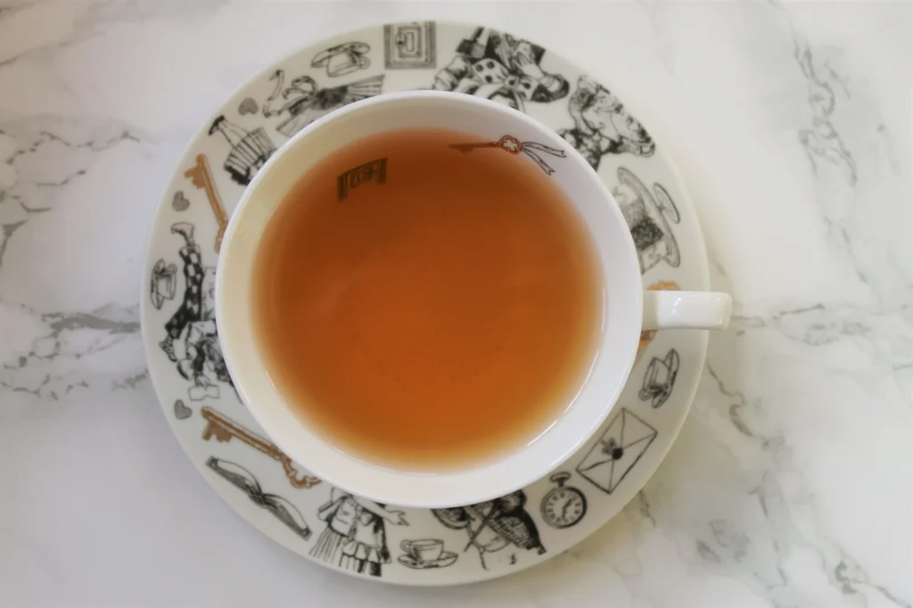 english tea shop green tea in white teacup