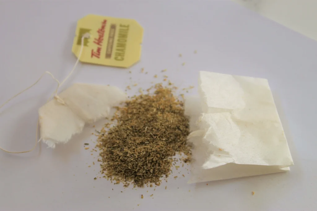 camomile flower petals from ripped teabag