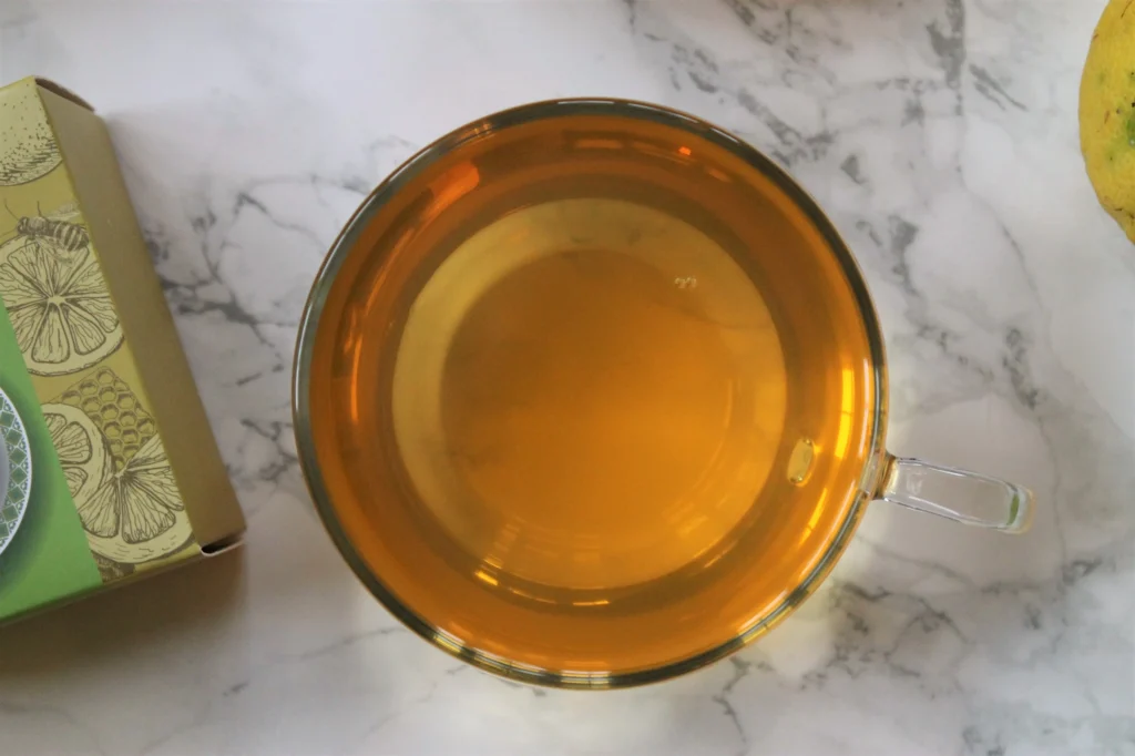 golden tea in glass teacup