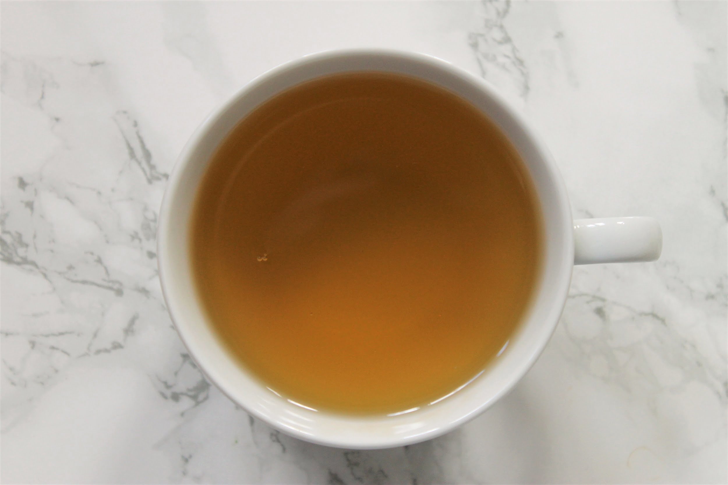 pure sri lanka green tea in teacup