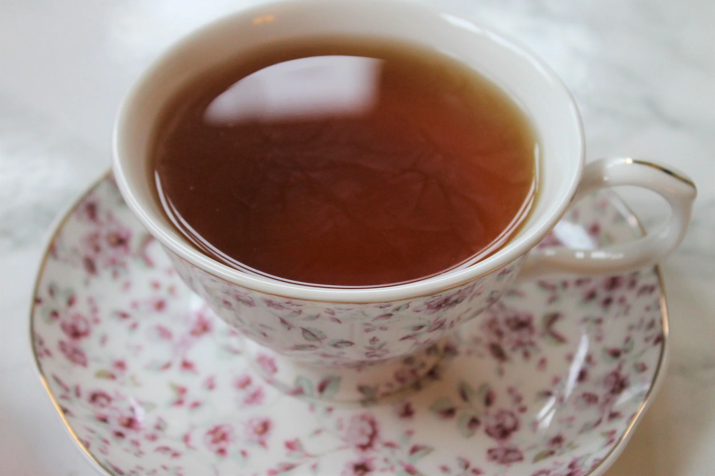 pink ditsy teacup with black tea
