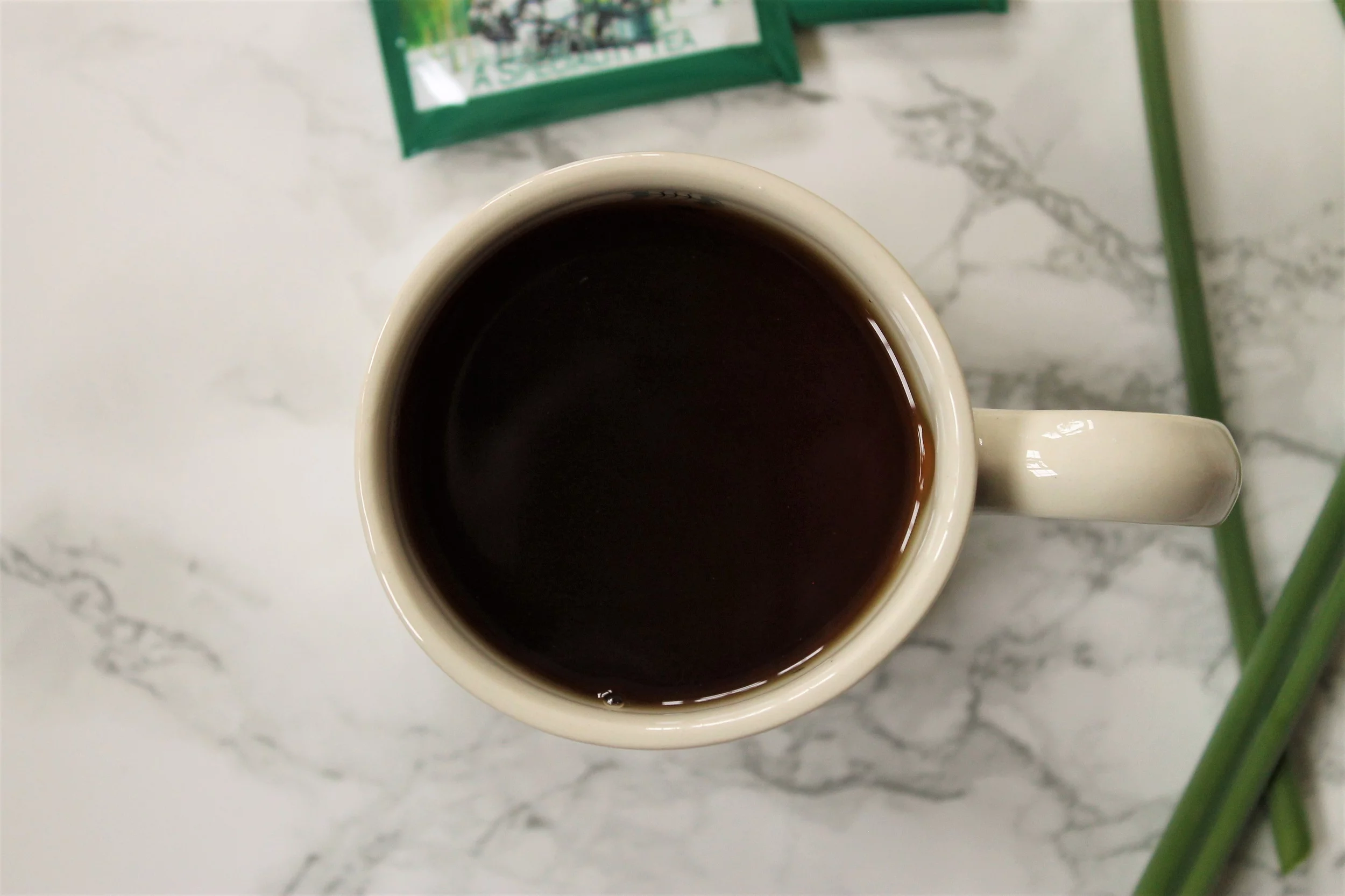 black maple tea in white mug