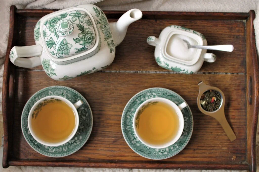 green china tea set with loose leaf tea