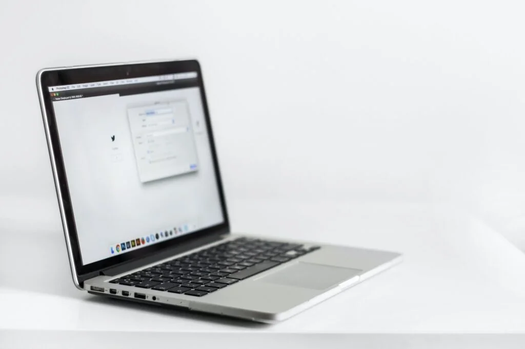 laptop on white table