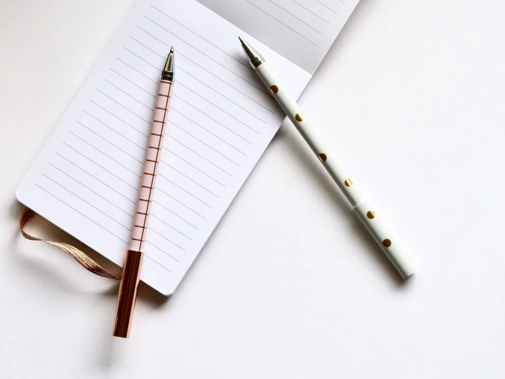 notepad and pens
