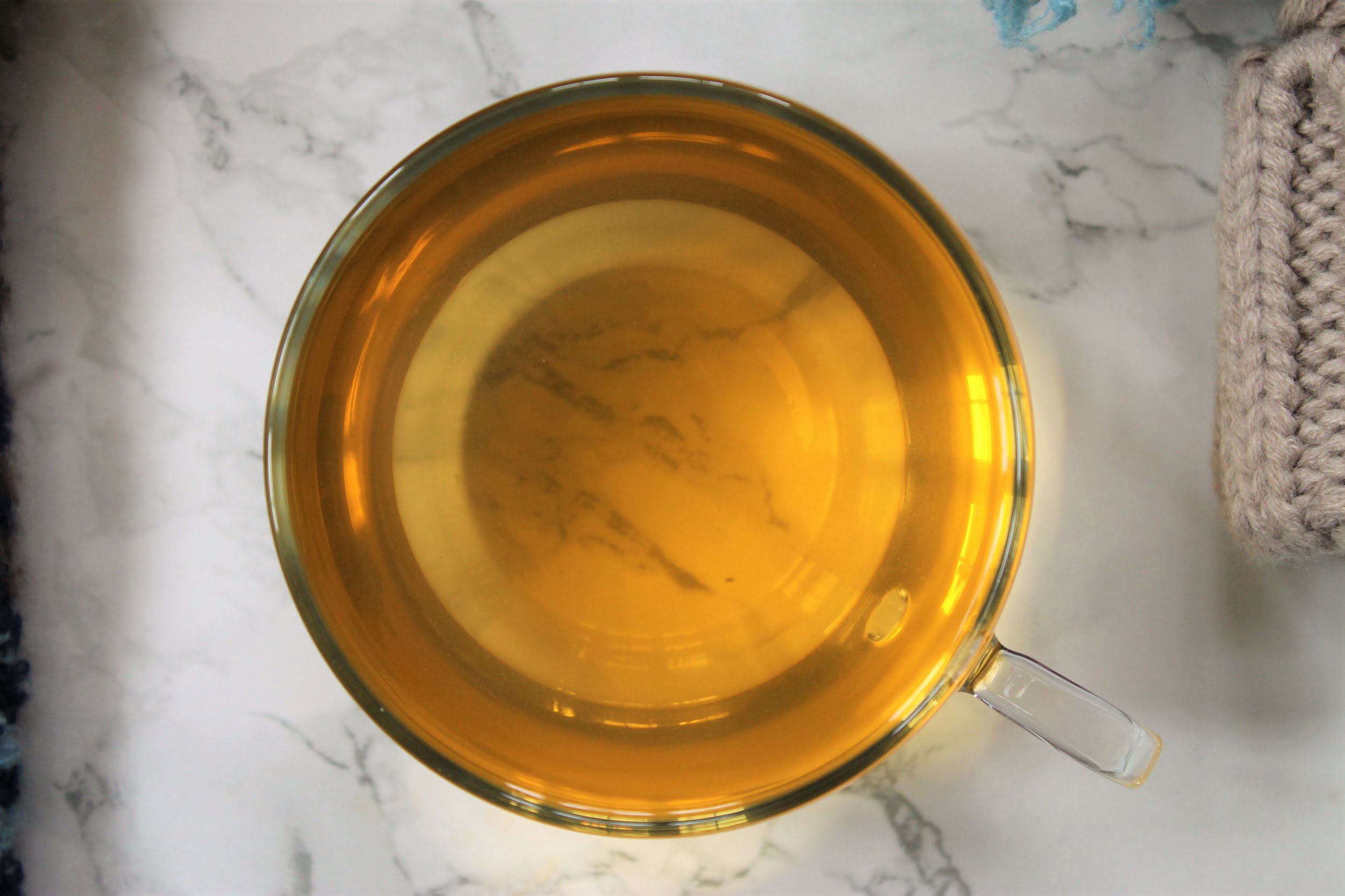 white tea review in glass teacup