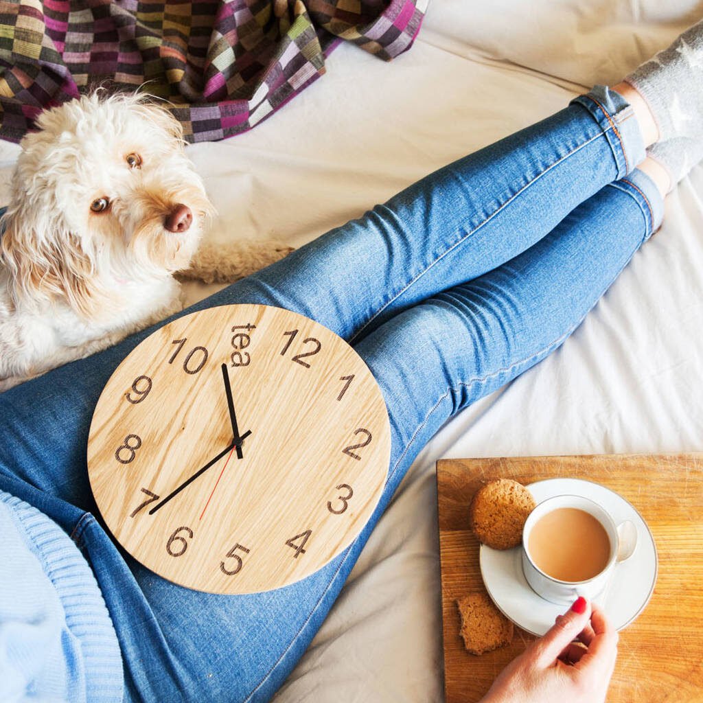 wooden clock on lap