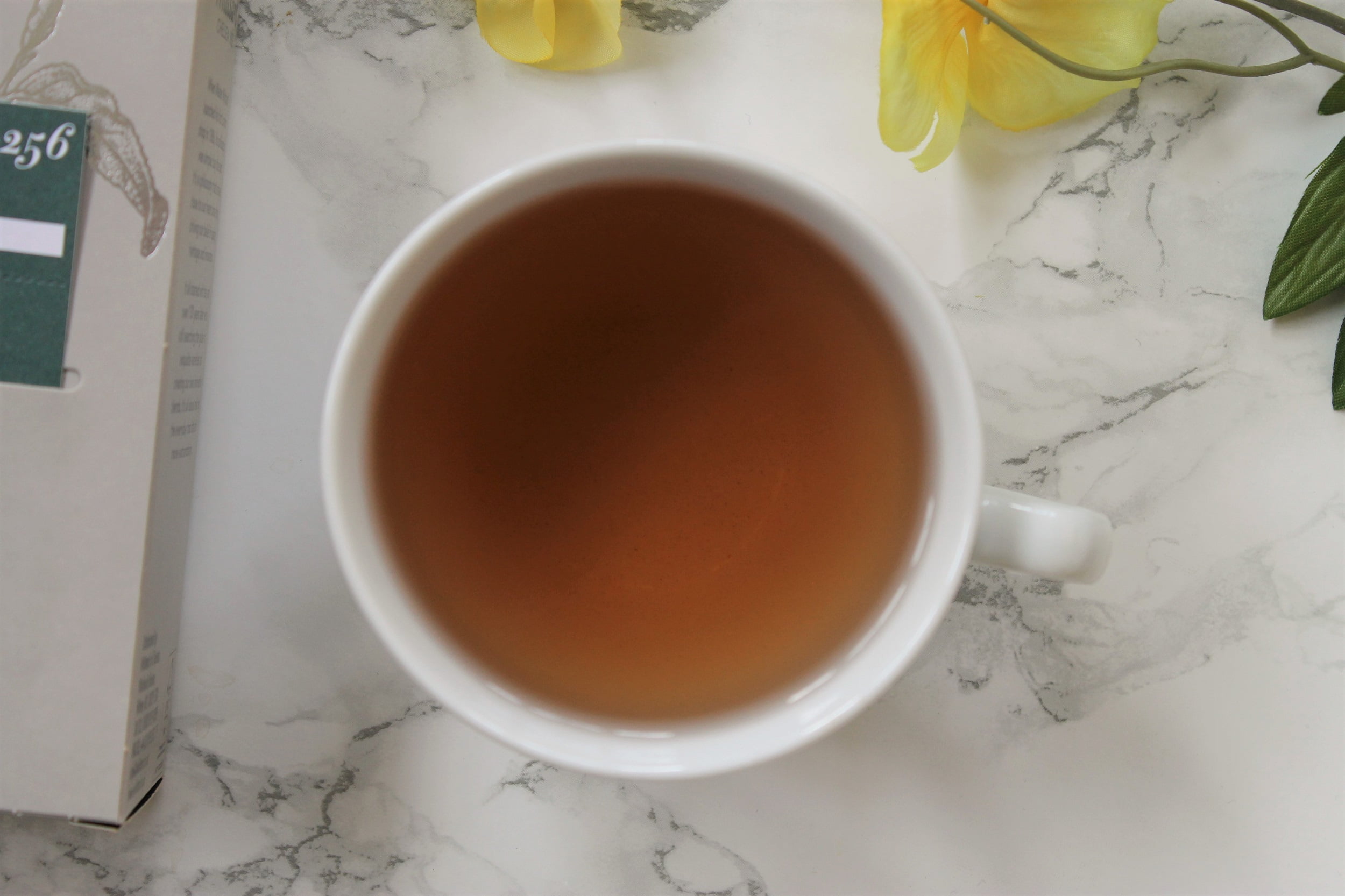 pink tea in white teacup