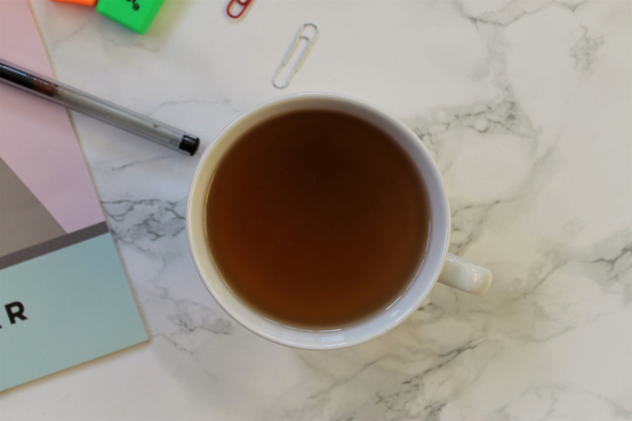 t2 fruit tea in white teacup