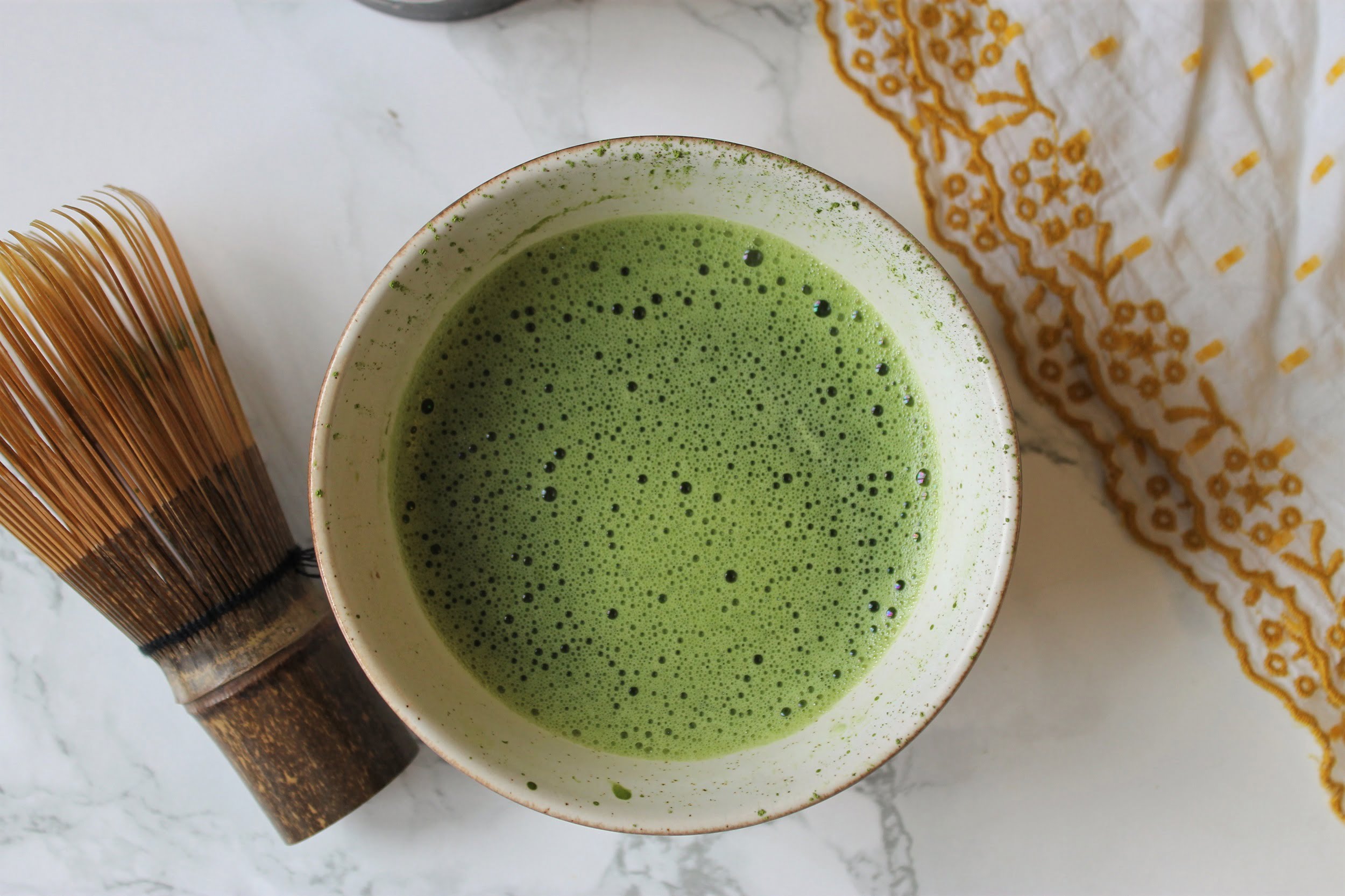 matcha in a bowl with chasen