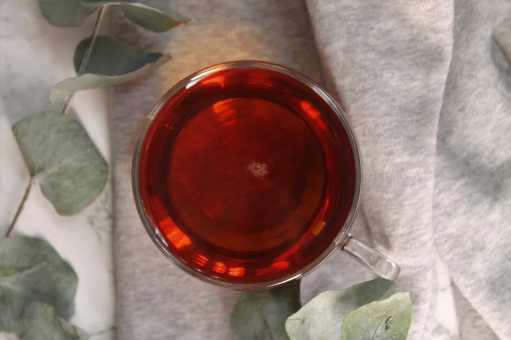 winter stars black tea in a glass teacup