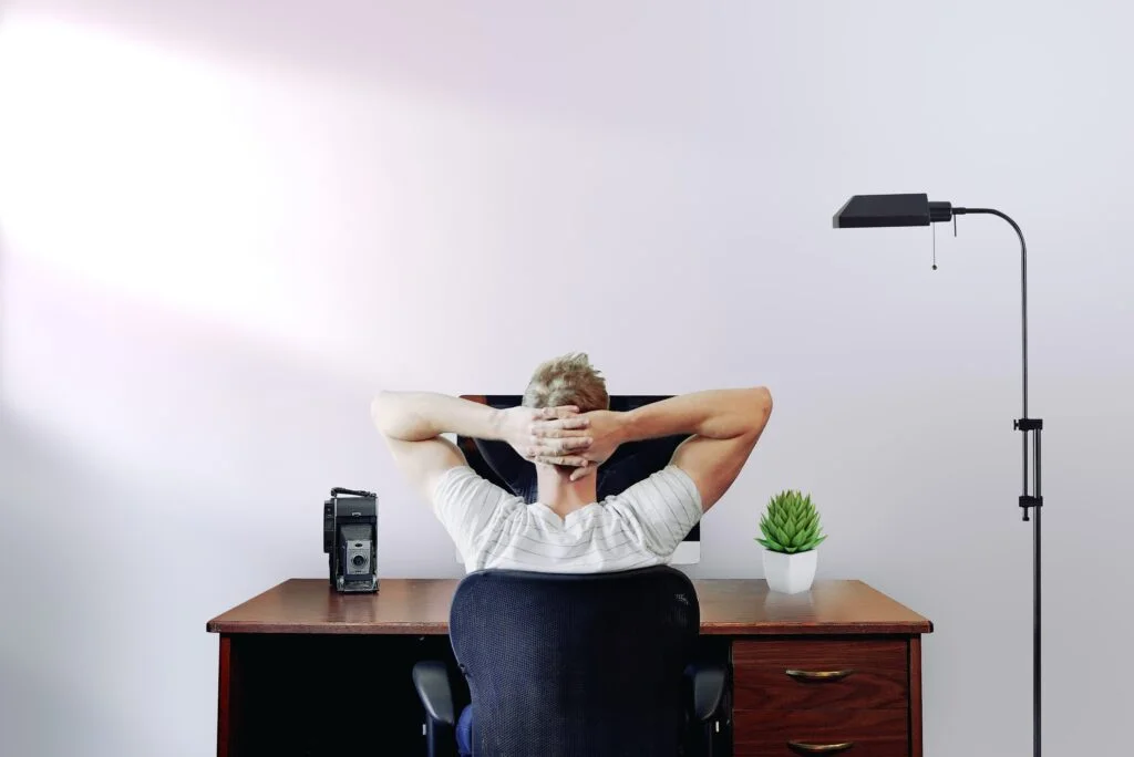 man working at a home office desk