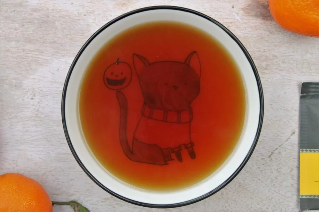 cup of black tea with citrus fruits