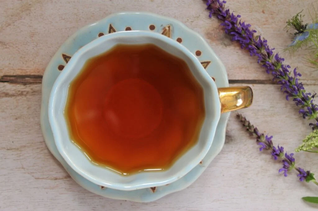 blue teacup full of rooibos tea