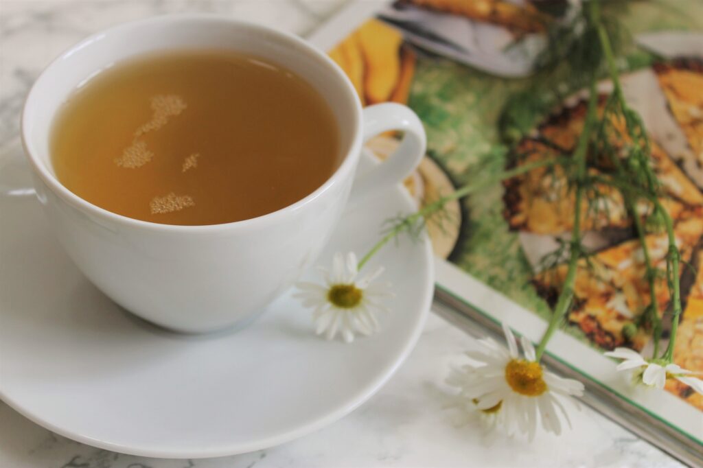 cup of pure green tea in a white teacup