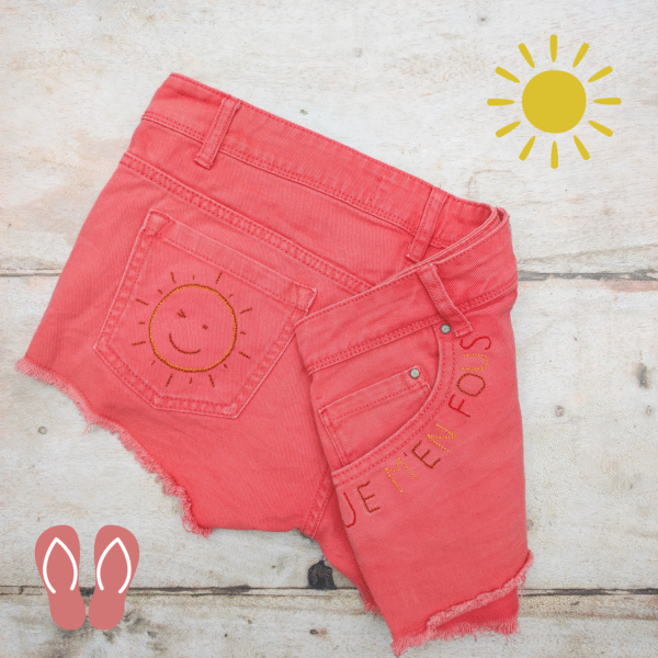 hot coral shorts embroidered with winking sun