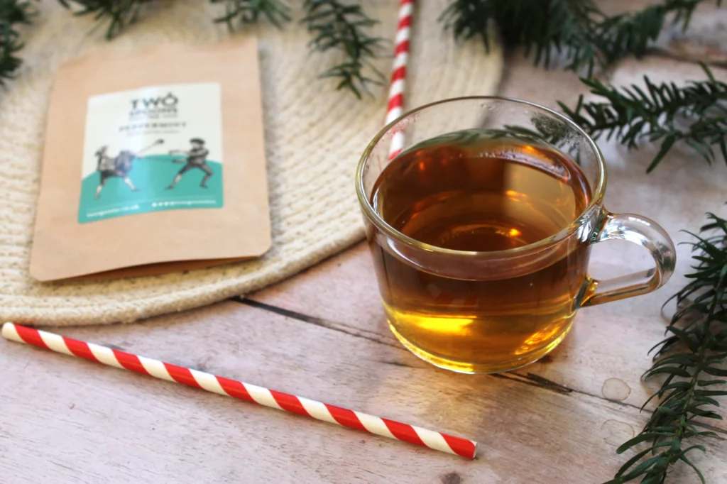 clear peppermint tea in a glass cup