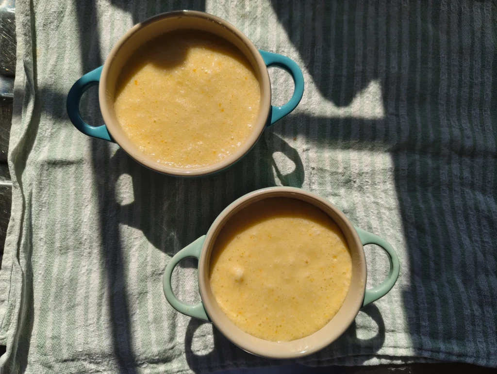 orange custard puddings before baking