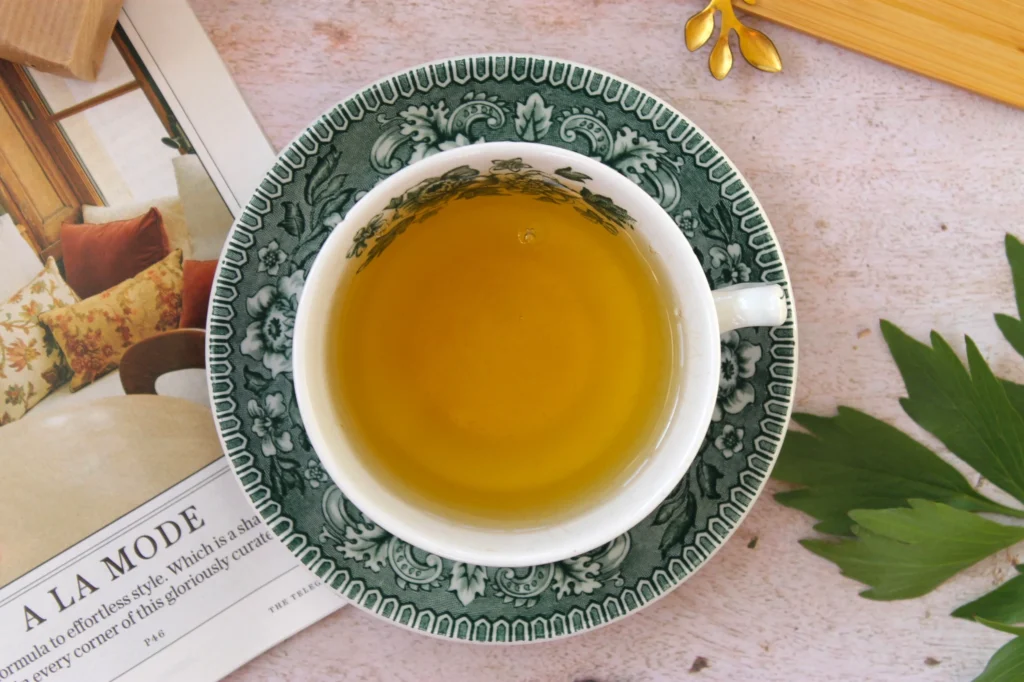 cup of green tea with mango flavour