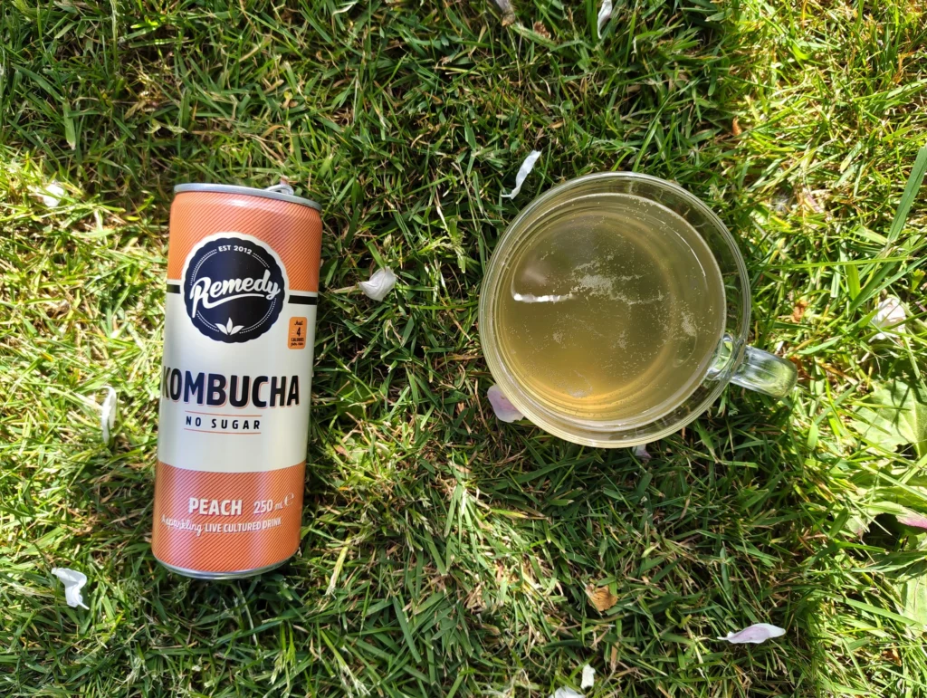 remedy kombucha peach flavour in grass