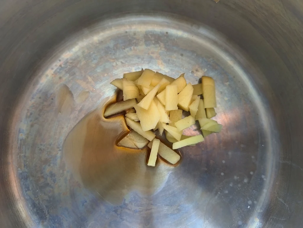 ginger and sesame oil in saucepan
