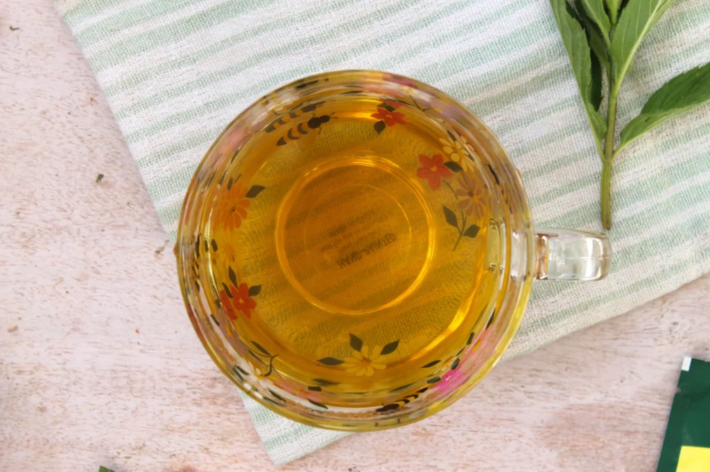 glass teacup of vahdam green tea