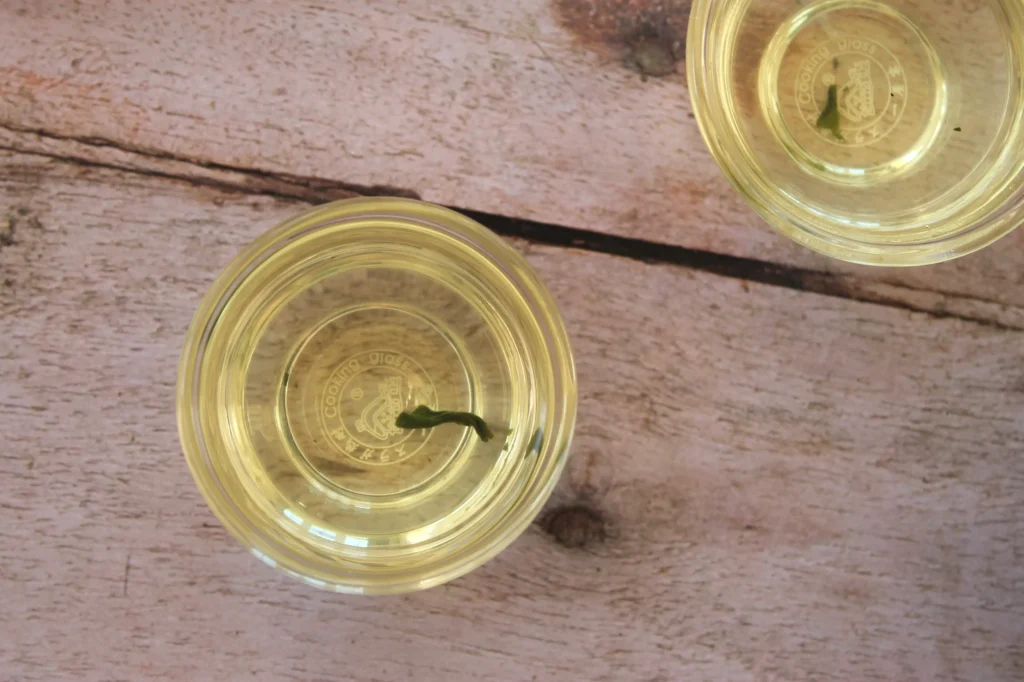 small glass teacup of green tea