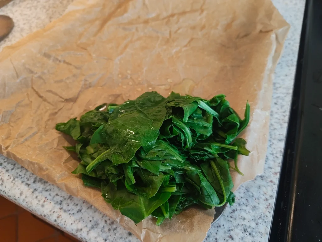 spinach leaves on baking tray