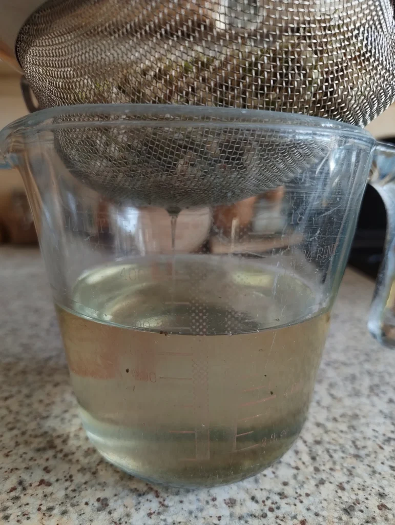 straining hawthorn syrup